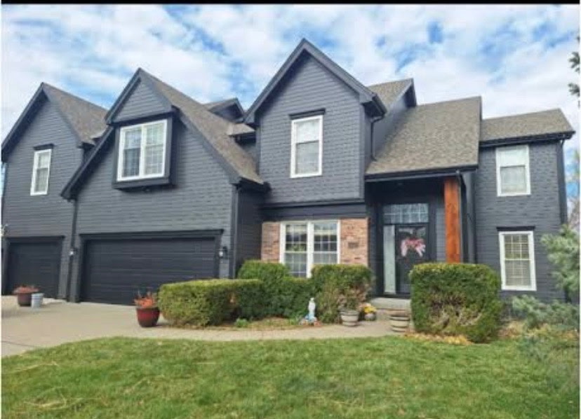 Modern home with black gutters installed