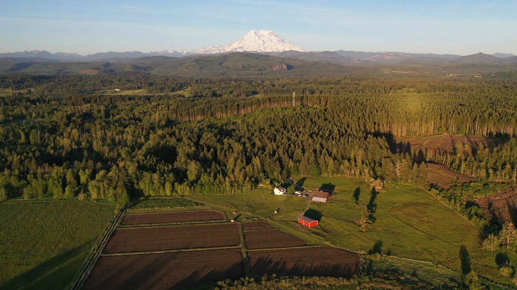 Aerial farm view toward Mount Rainier near Enumclaw, WA
