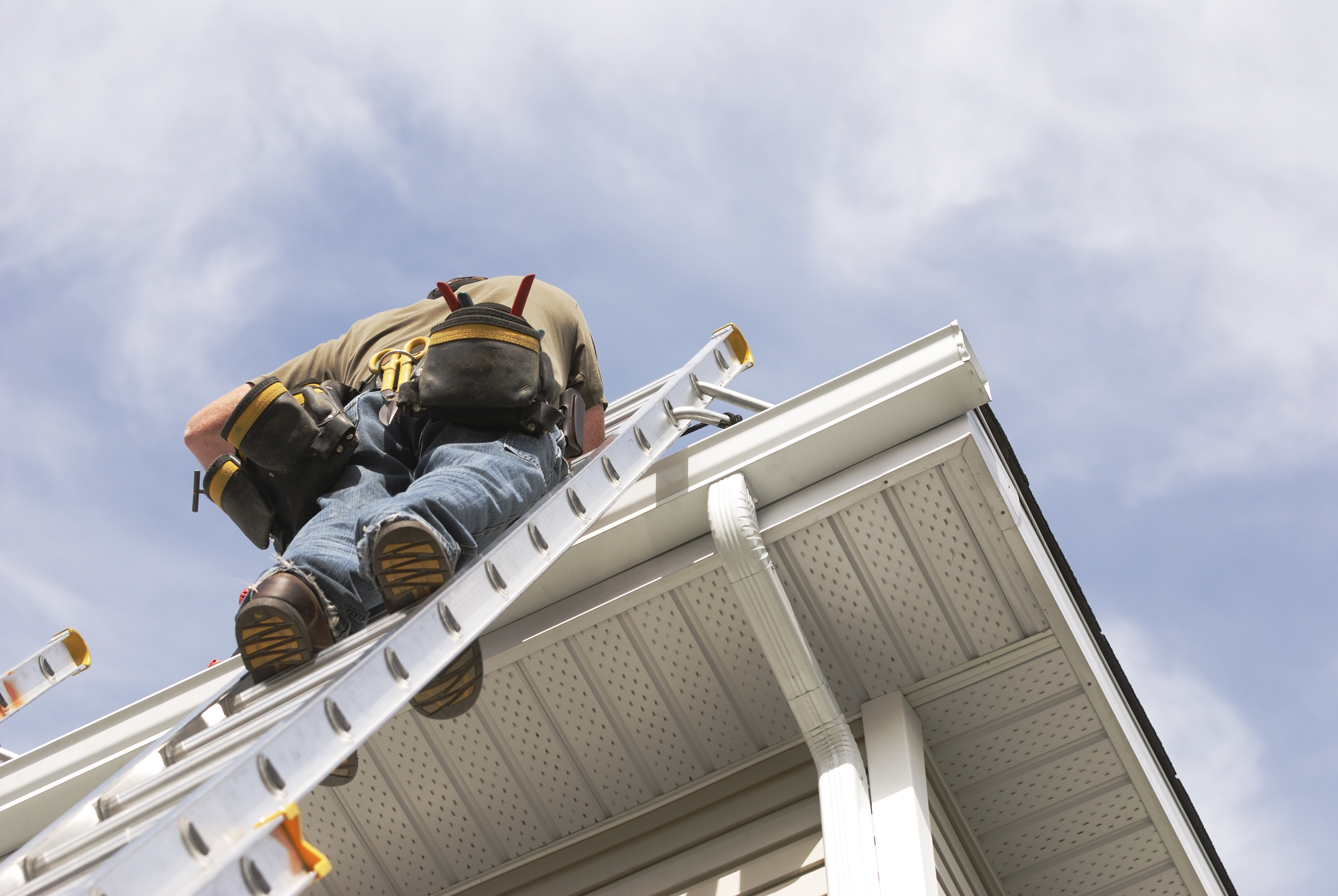 Crew installing seamless gutters